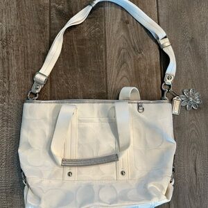 Selling this white and silver coach purse. This purse has never been used!